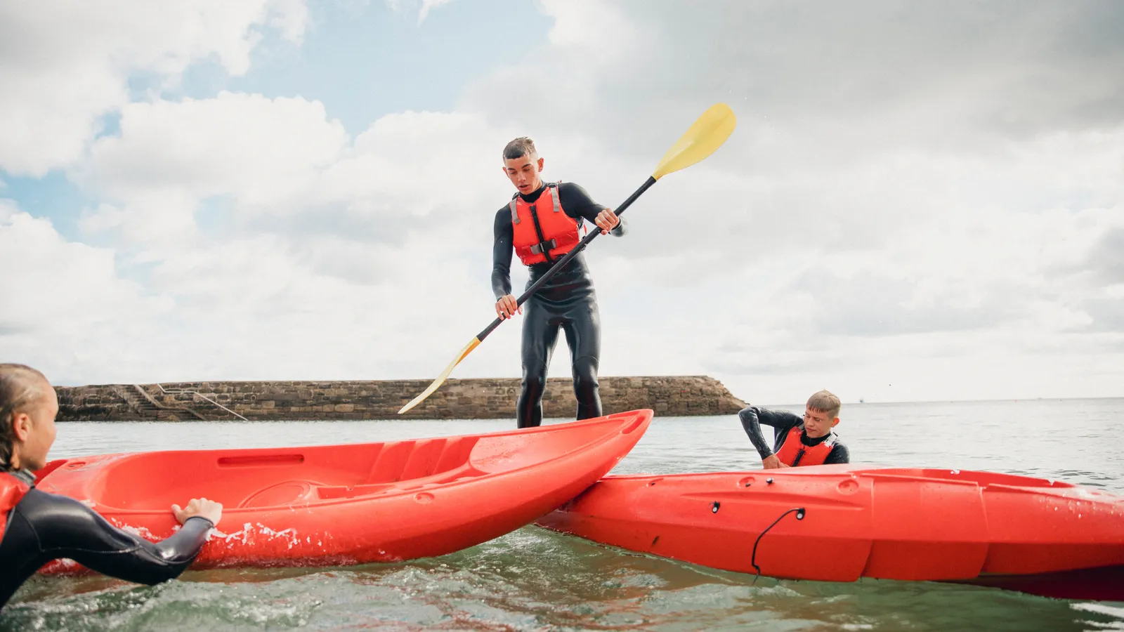Person trying to stand in a kayak